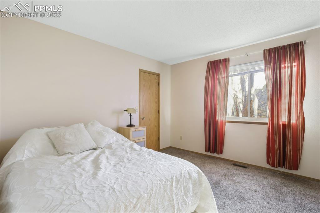 Image 18 of 31: Bedroom 2 on upper level.