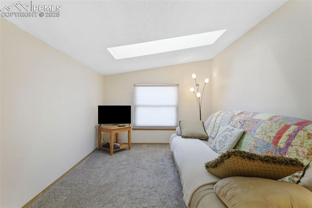 Image 21 of 31: This cozy loft is just a few steps up from the upper level. Will you use th