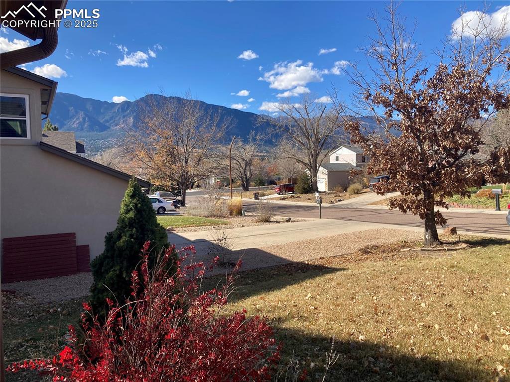 Image 4 of 31: This is the amazing view of Cheyenne Mountain from the front porch! Relax a
