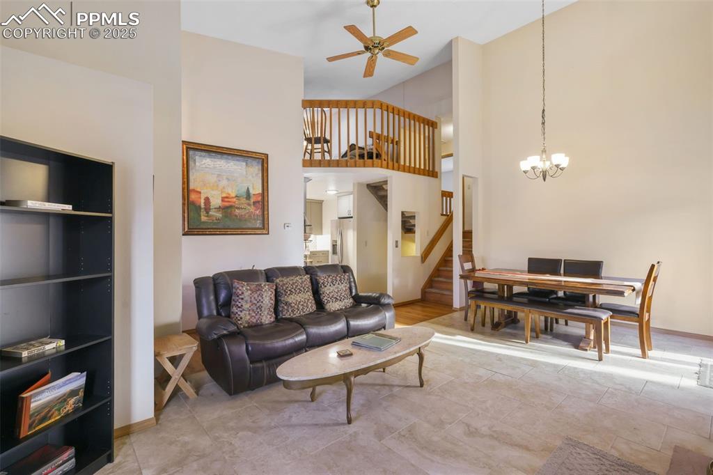 Image 7 of 31: The open living area is accented by soaring ceilings and grants views of th