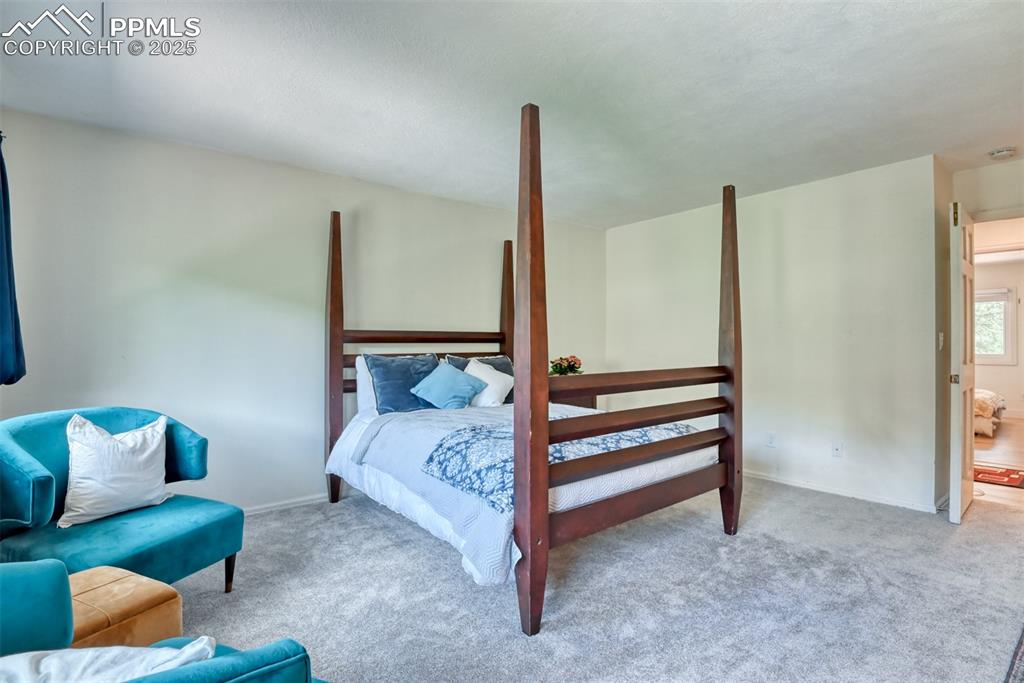 Image 22 of 50: Carpeted bedroom featuring baseboards