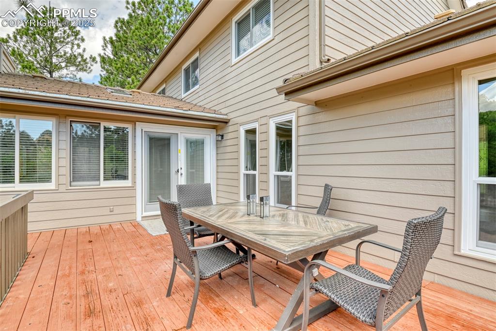 Image 41 of 50: Wooden deck featuring outdoor dining area