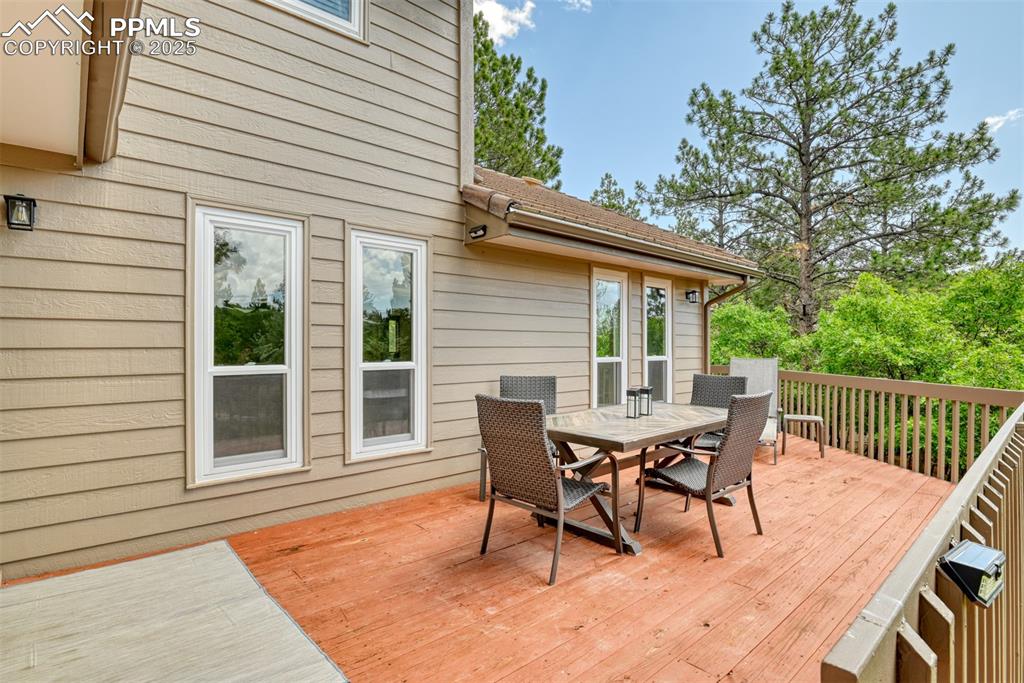 Image 42 of 50: Wooden terrace featuring outdoor dining space