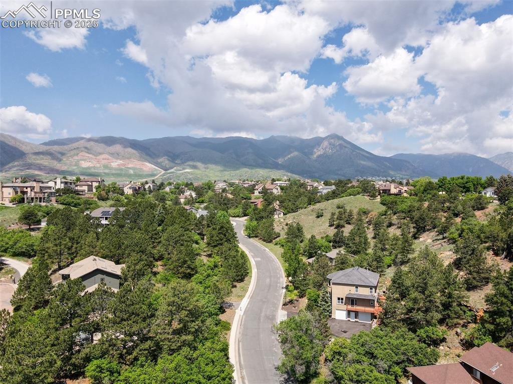 Image 50 of 50: Aerial view of residential area featuring mountains