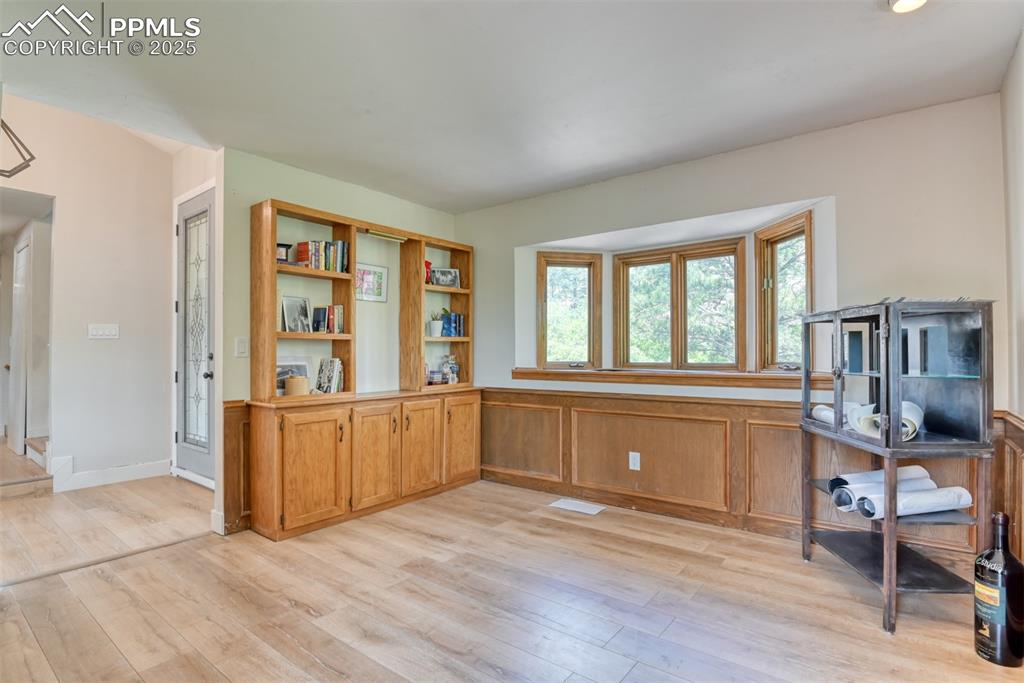 Image 6 of 50: Office or front room space featuring light wood finished floors