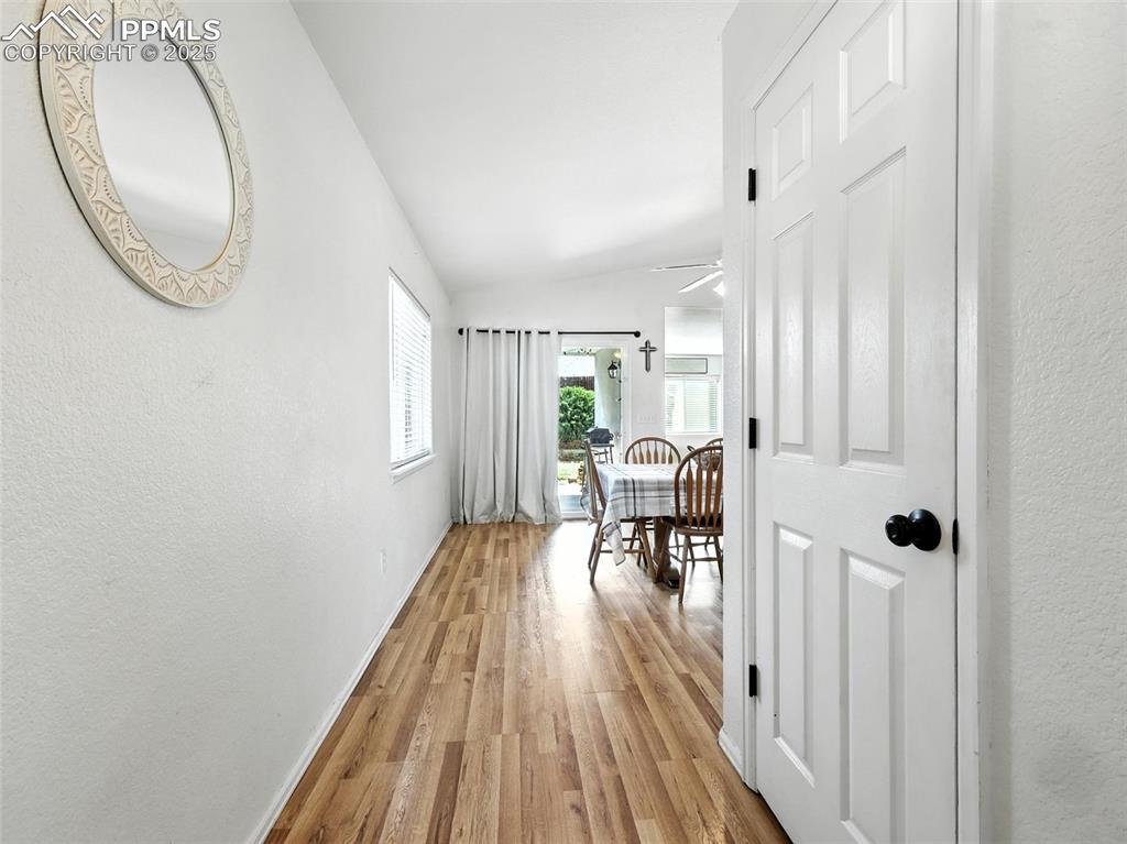 Image 12 of 38: main entrance to house coat closet to right after kitchen entrance