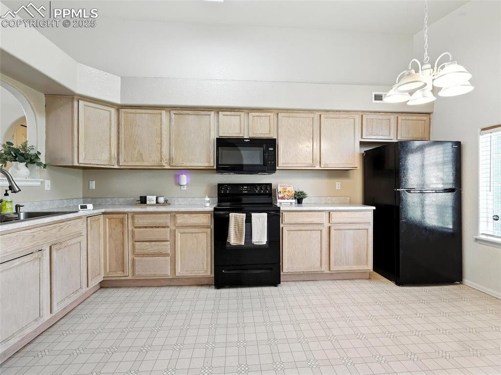 Image 13 of 38: entrance view to large spacious kitchen