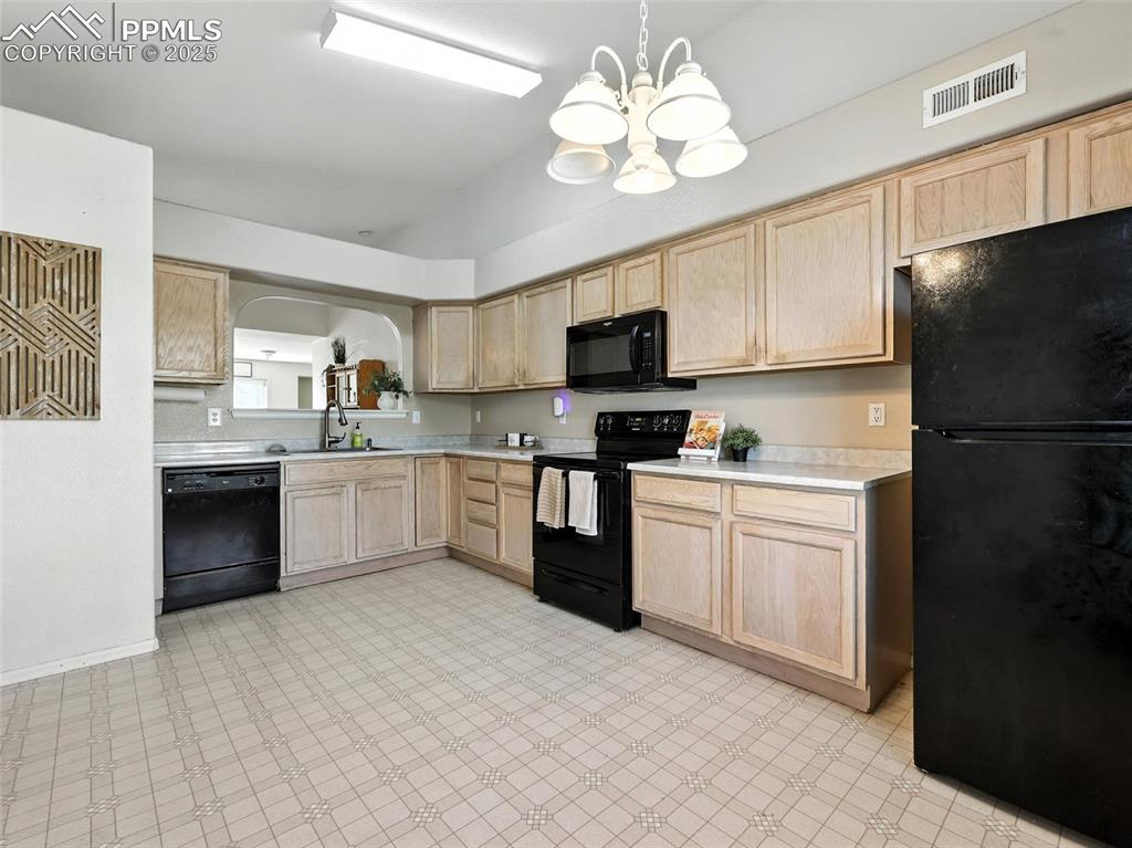 Image 15 of 38: Service window from kitchen to dining room