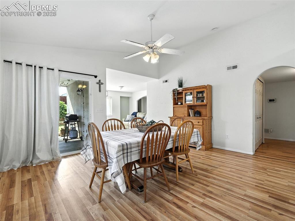 Image 18 of 38: slider door accesses covered patio from dining room