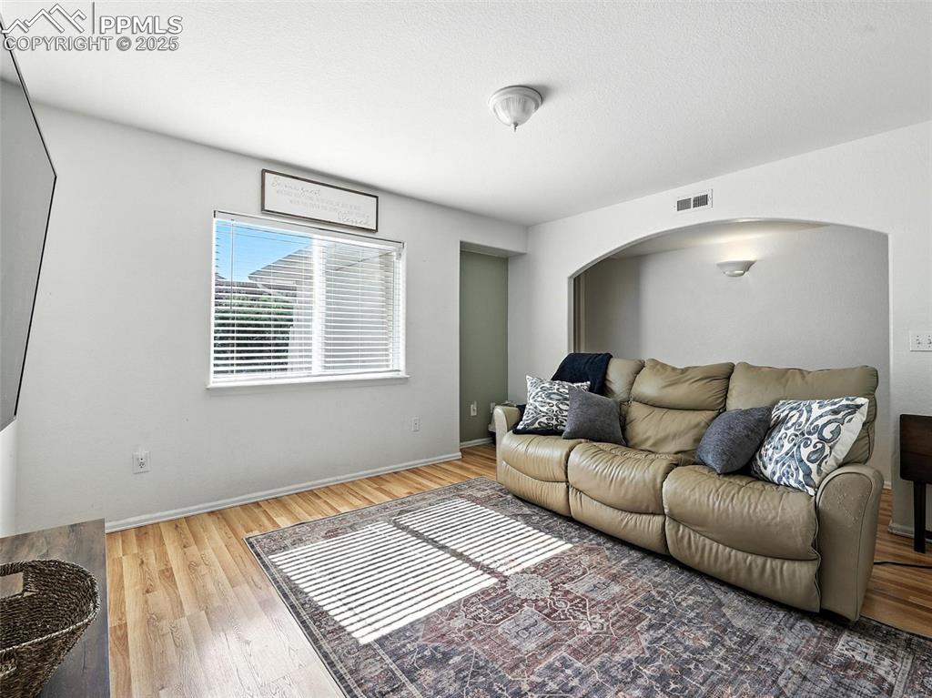 Image 20 of 38: living room with niche natural lighting