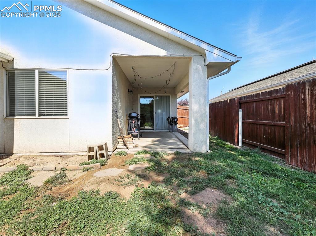 Image 35 of 38: rear of house, view of covered patio