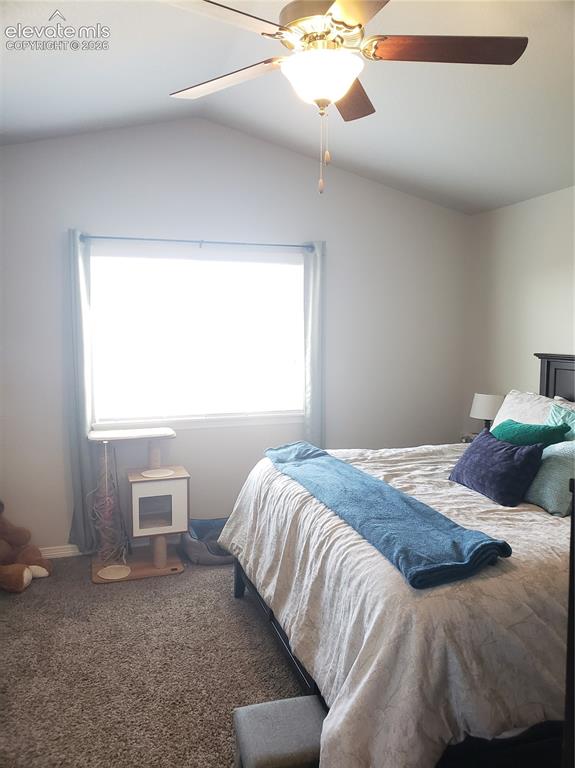 Image 14 of 34: Vaulted ceiling featuring a ceiling fan with integrated lighting