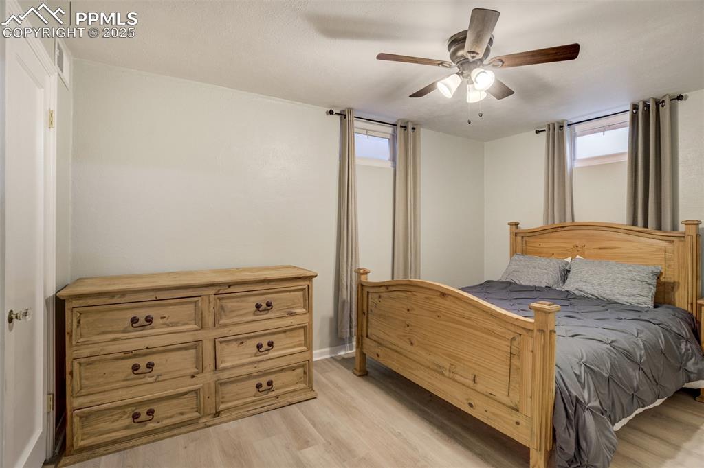 Image 33 of 48: Bedroom featuring light wood-style flooring, multiple windows, and ceiling 