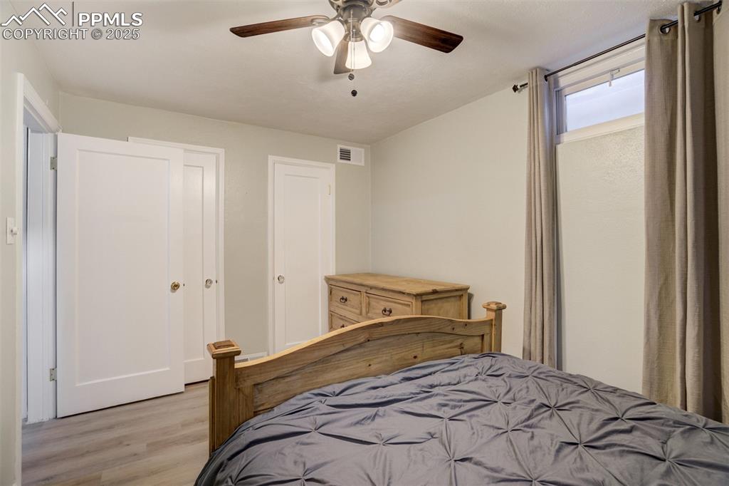 Image 34 of 48: Bedroom featuring light wood-type flooring and a ceiling fan