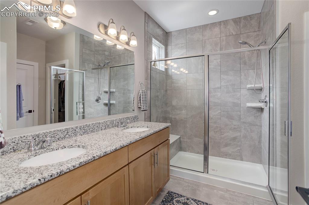 Image 11 of 22: Primary bath w/ walk-in shower