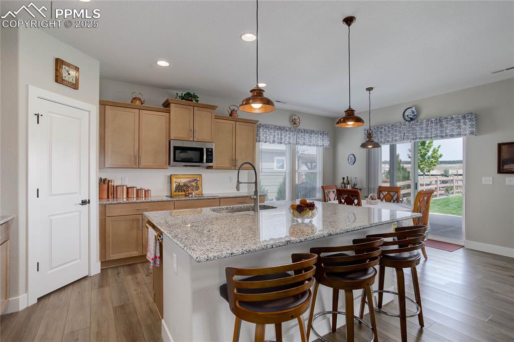 Image 6 of 22: Granite counters & barstool seating