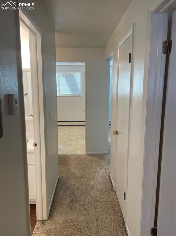 Image 26 of 27: Unit 3 hallway looking towards the kitchen
