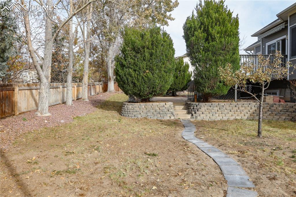 Image 47 of 49: View of yard featuring a wooden deck