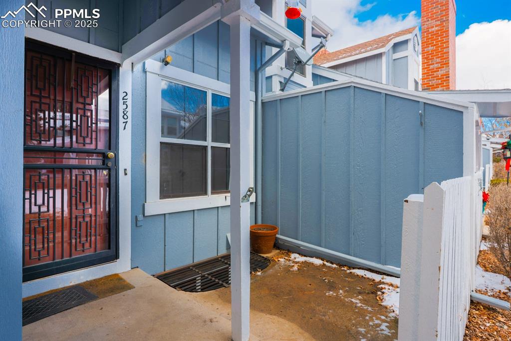Image 10 of 27: Front Door with Private Patio