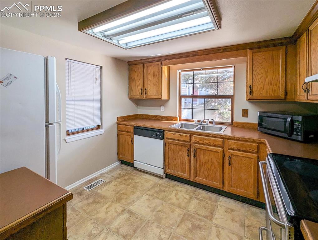 Image 14 of 27: Kitchen with Windows and all appliances