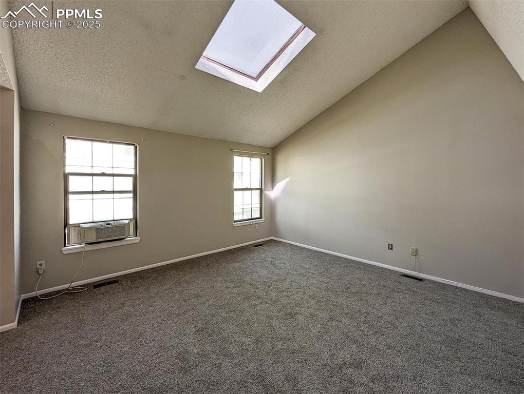Image 21 of 27: Primary Suite with Sky Light
