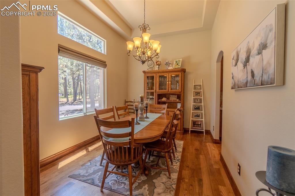 Image 18 of 50: Formal dining room at the front of the main level