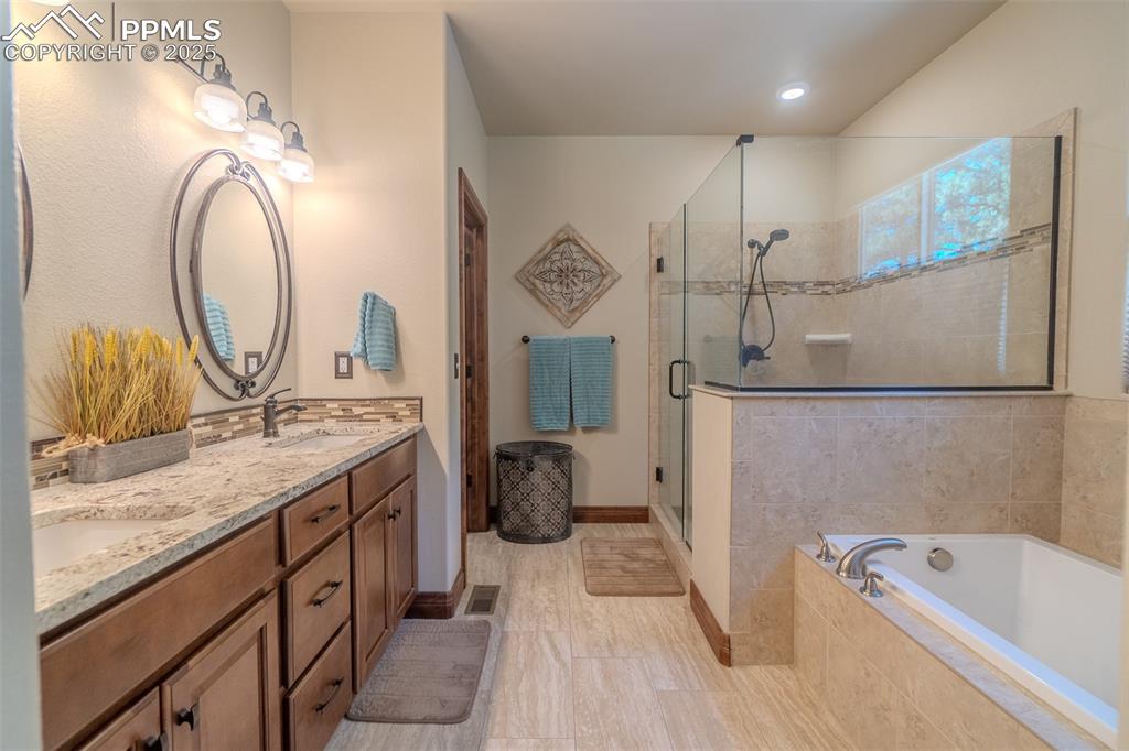 Image 21 of 50: Spa inspired primary bathroom