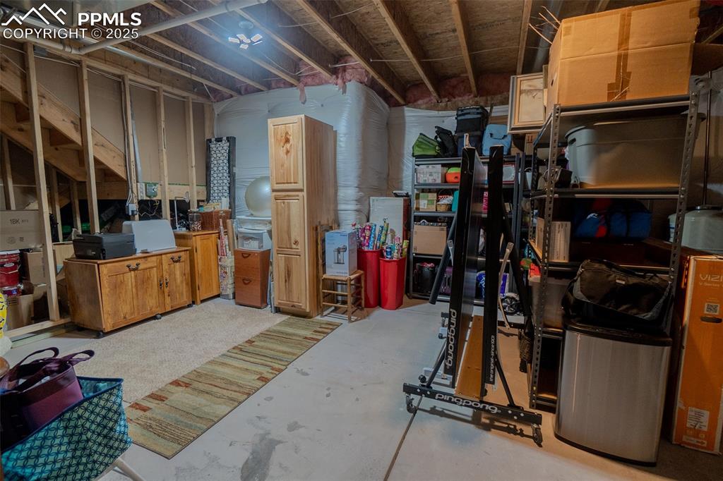 Image 41 of 50: Expansive basement storage room