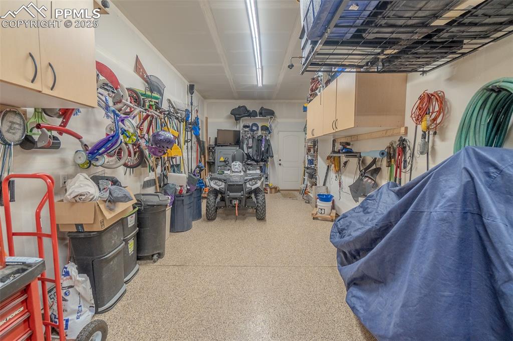 Image 43 of 50: 5th garage bay, currently a workshop