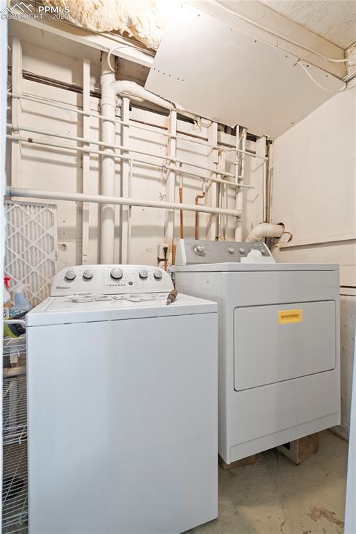 Image 16 of 34: Washroom with separate washer and dryer