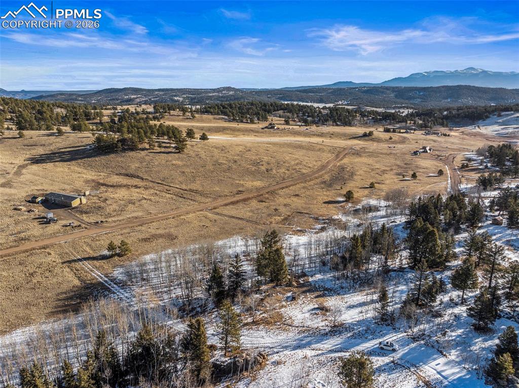 Image 10 of 25: Overview of rural landscape with a mountain backdrop