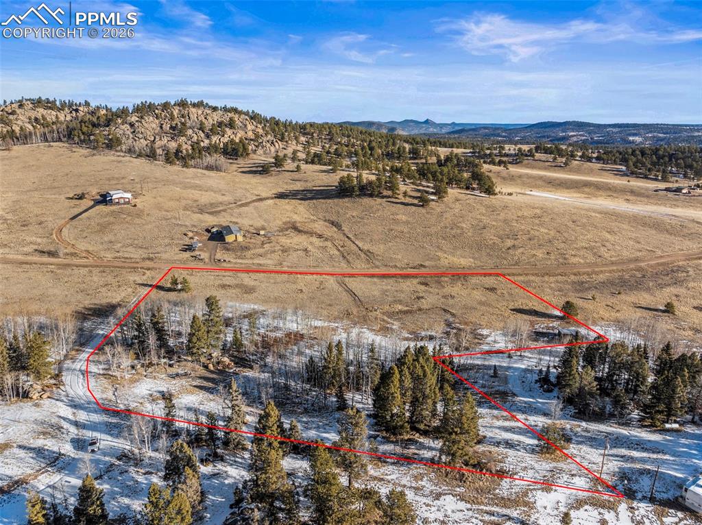 Image 11 of 25: Overview of rural landscape featuring property boundaries highlighted and a