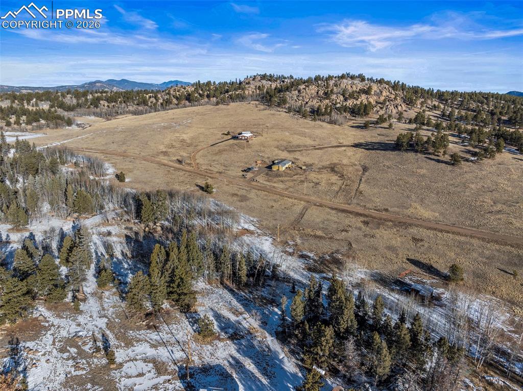 Image 14 of 25: View of rural area with mountains