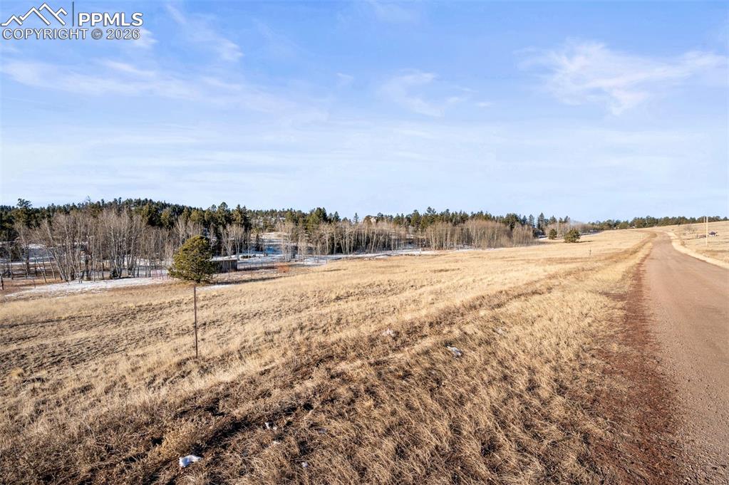 Image 17 of 25: View of yard featuring a view of rural / pastoral area