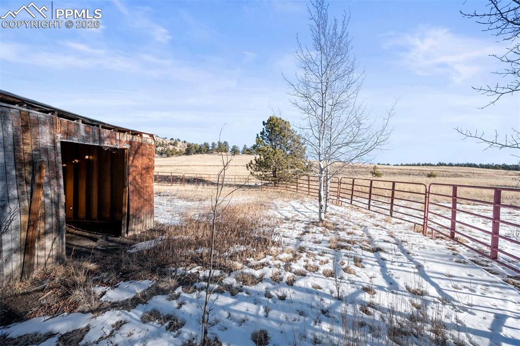 Image 19 of 25: Snowy yard with a view of countryside