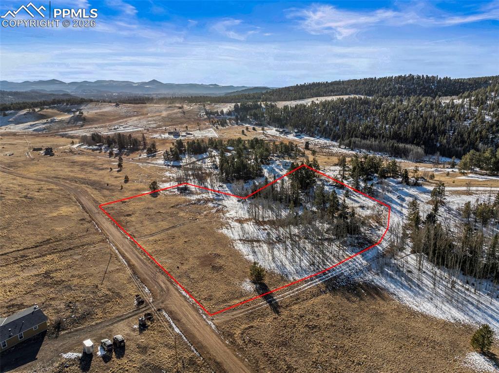 Image 5 of 25: View of property location with property parcel outlined and a mountainous b