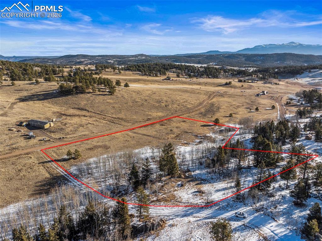 Image 9 of 25: View of rural area featuring property boundaries highlighted and a mountain