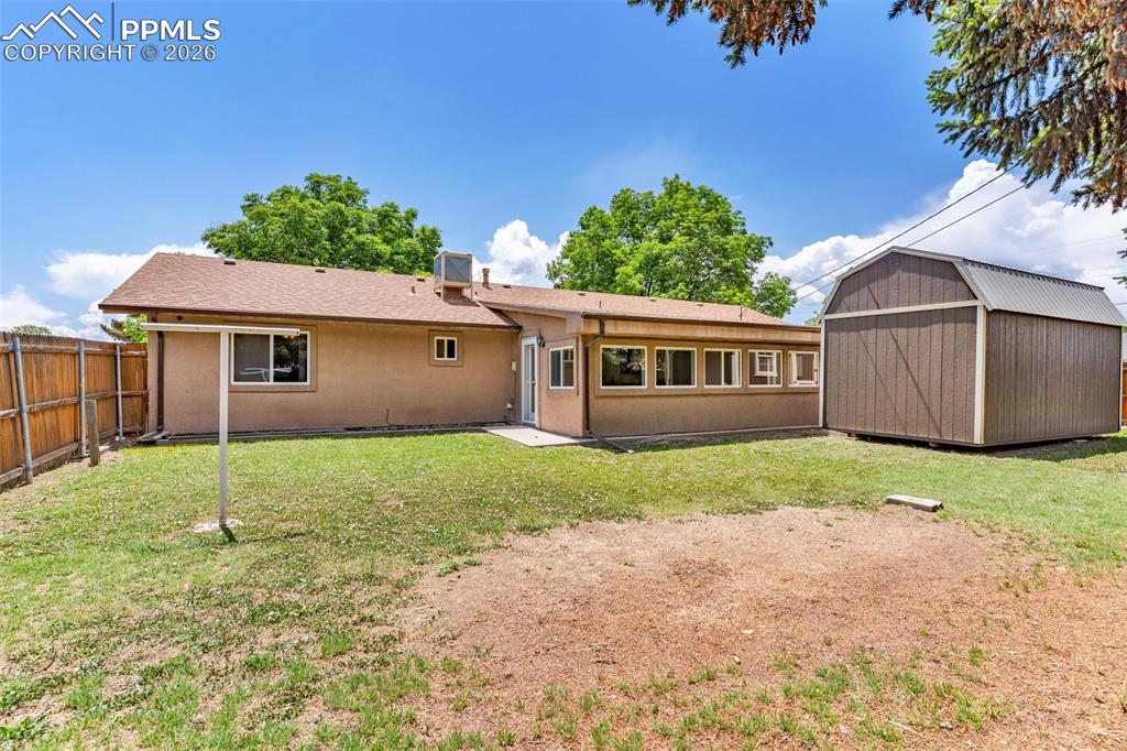 Image 28 of 42: Rear view of property with stucco siding