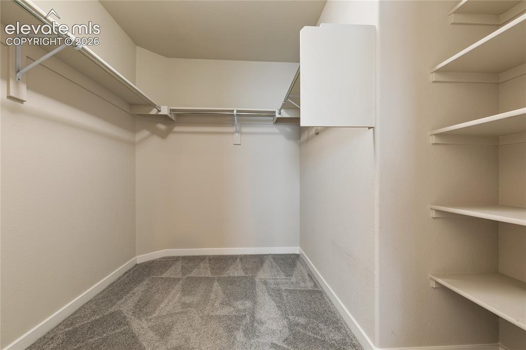 Image 20 of 29: Primary walk-in closet