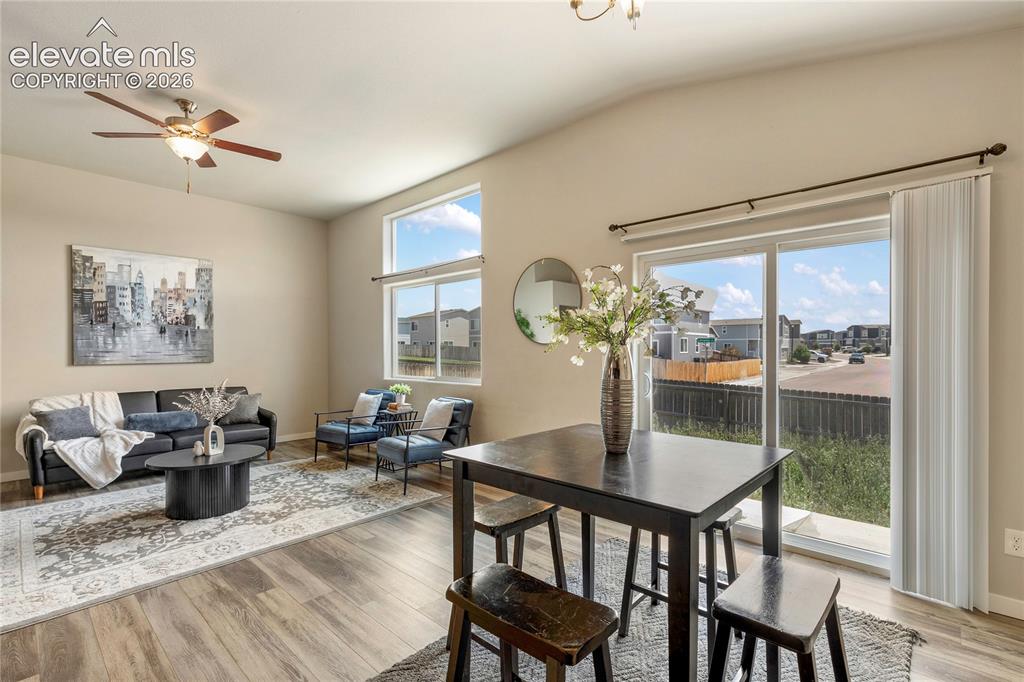 Image 6 of 29: Open floor plan with vaulted ceilings - dining area walks out to the back y
