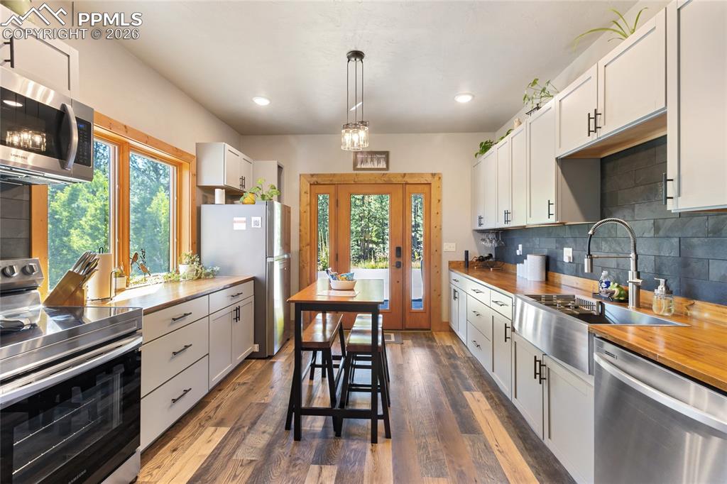 Image 20 of 31: I know you wanted to see the lower level apartment...come in!