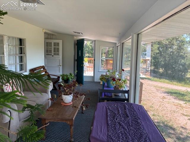 Image 14 of 30: Sunroom with vaulted ceiling