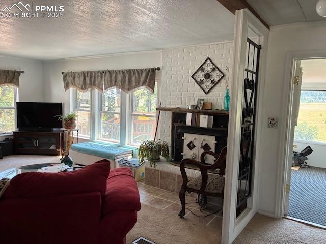 Image 17 of 30: Carpeted living area with a textured ceiling and a brick fireplace