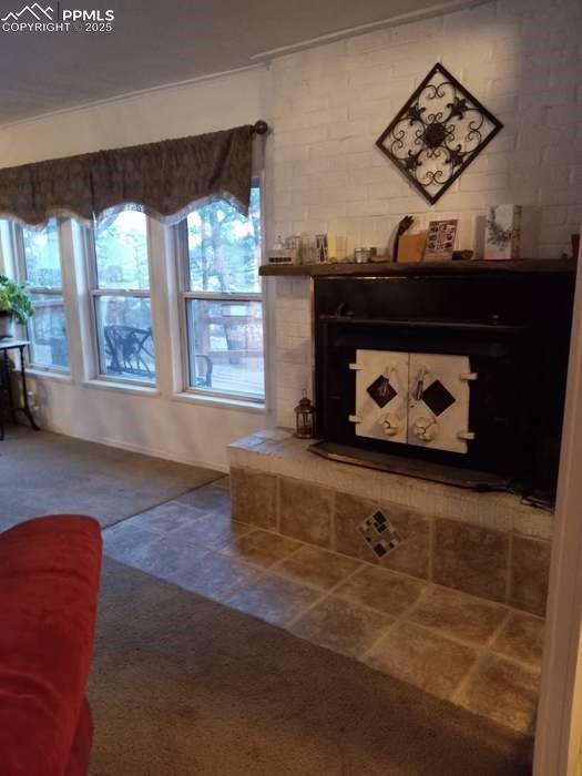 Image 5 of 30: Detailed view of a fireplace with raised hearth