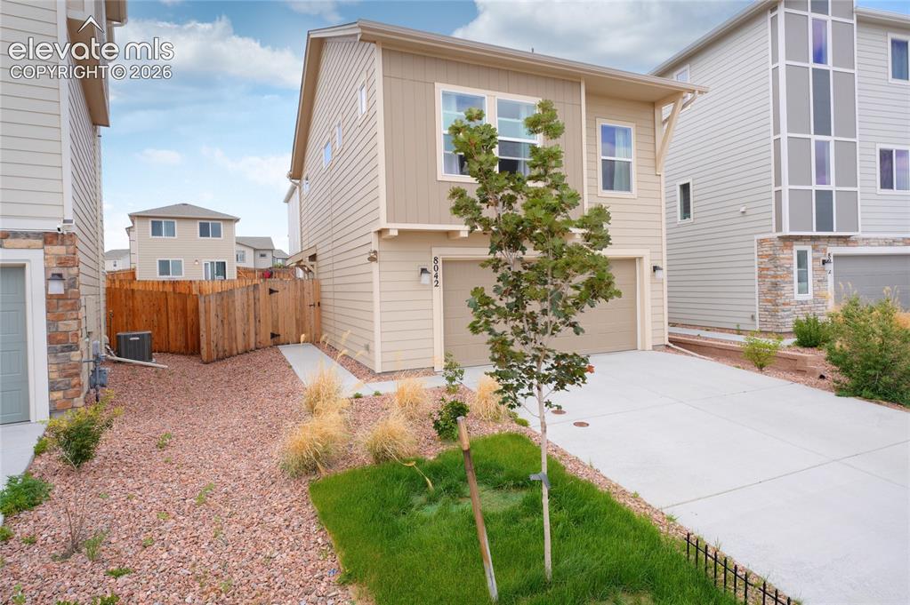 Image 2 of 21: Contemporary two-story residence with a two-car garage