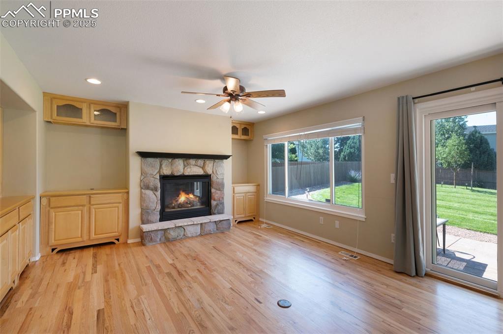 Image 13 of 37: Unfurnished living room with recessed lighting, light wood-style flooring,