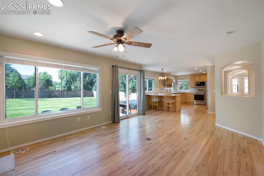 Image 14 of 37: Unfurnished living room with recessed lighting, light wood-type flooring, a