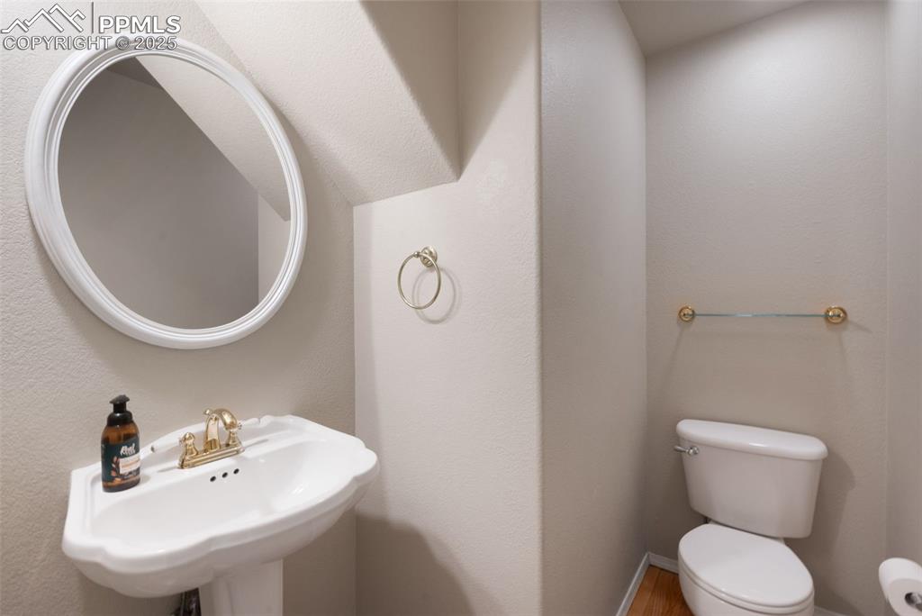 Image 16 of 37: Half bathroom with a textured wall