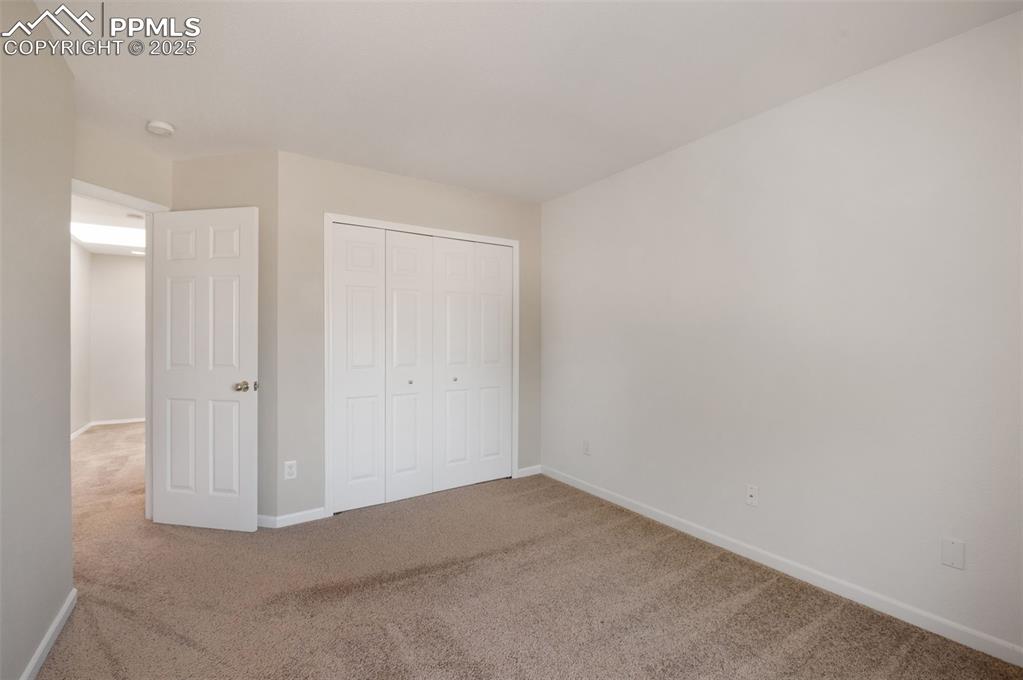 Image 27 of 37: Unfurnished bedroom featuring carpet and a closet
