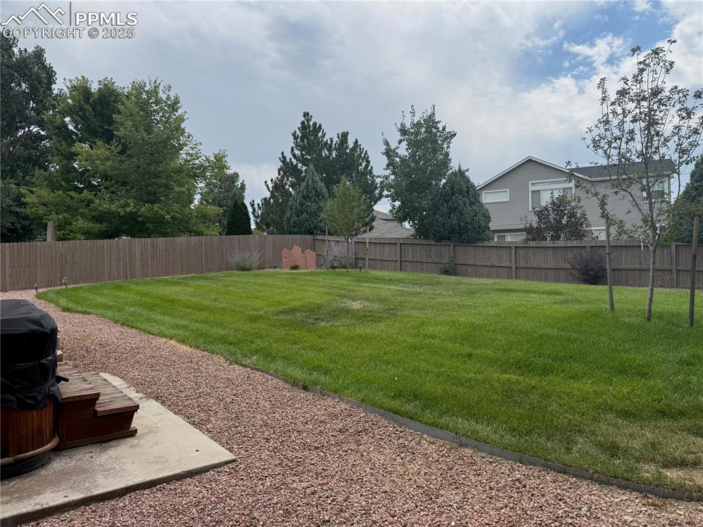 Image 34 of 37: View of fenced backyard